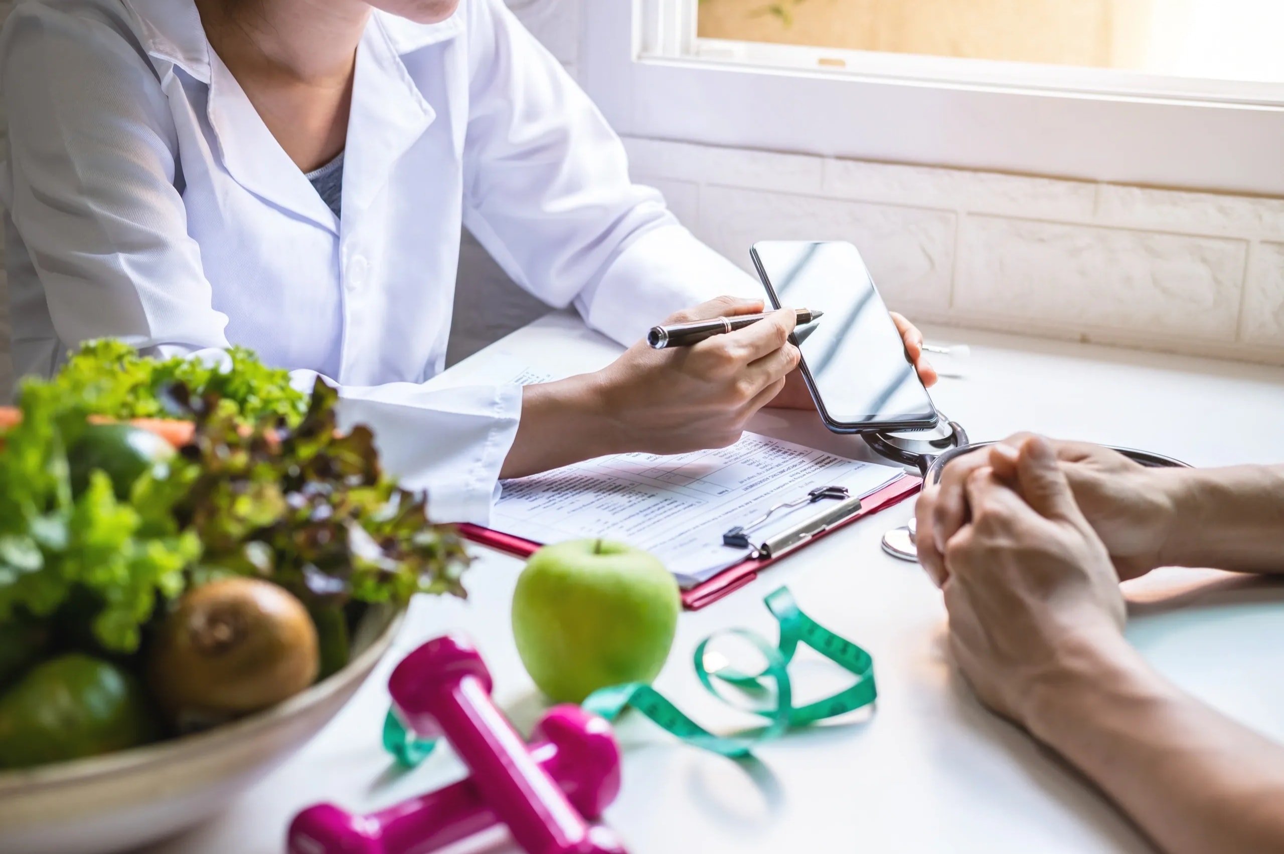 Doctor consulting with patient on medical weight loss program